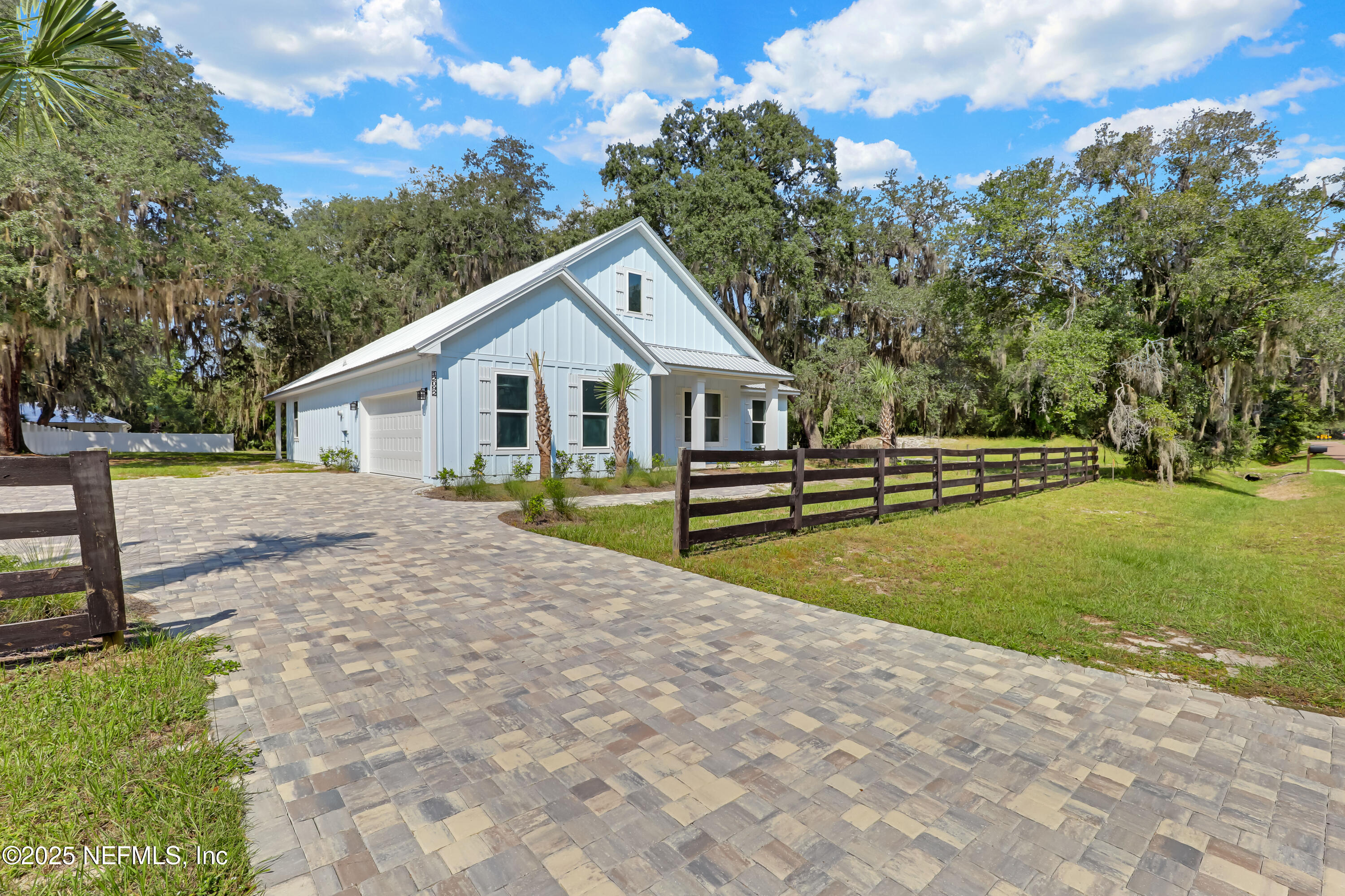 12092 Sheffield Road Jacksonville, FL 32226 - Photo 43 of 55 a view of a house with backyard and trees