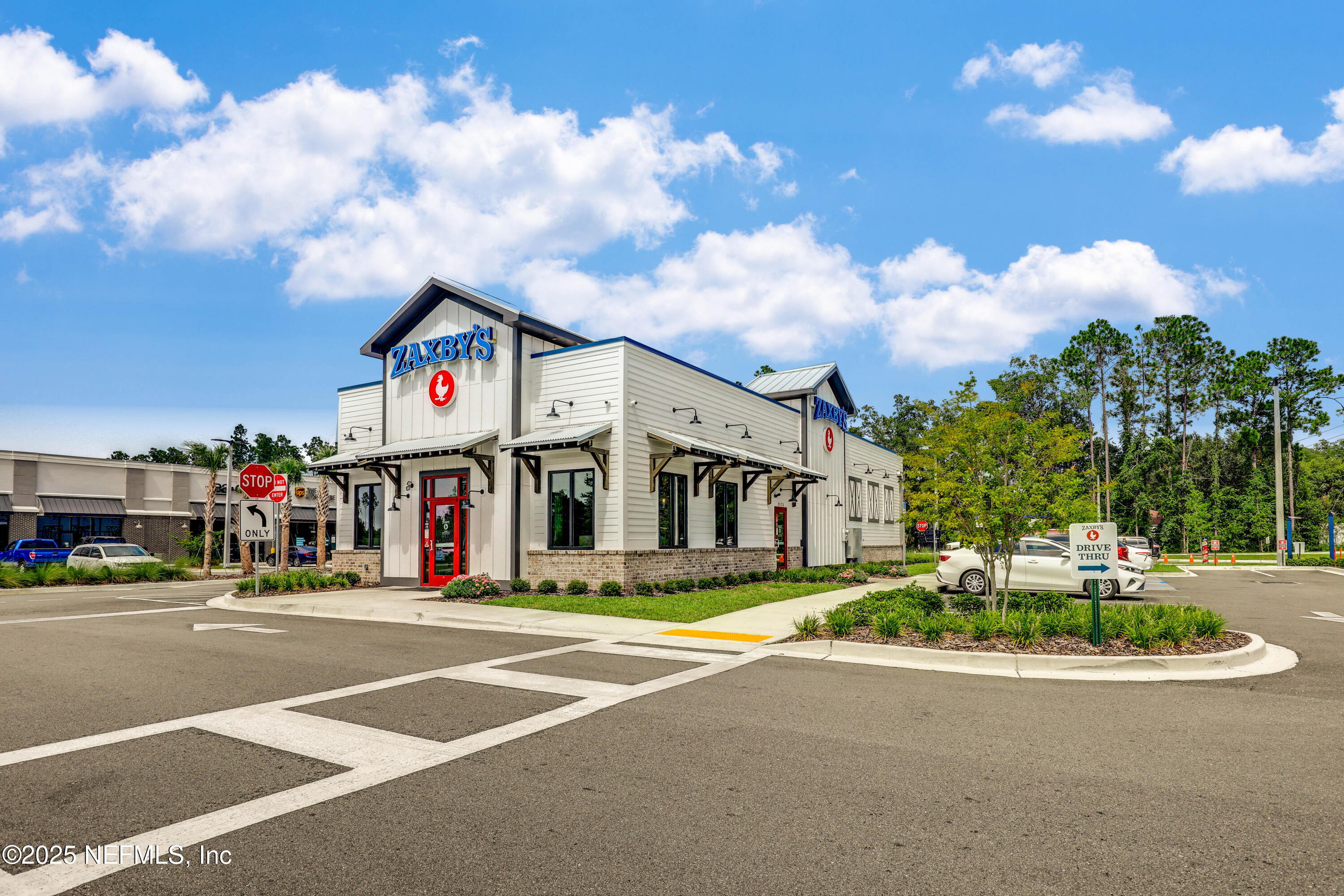 12092 Sheffield Road Jacksonville, FL 32226 - Photo 47 of 55 a front view of multi story residential apartment building with yard
