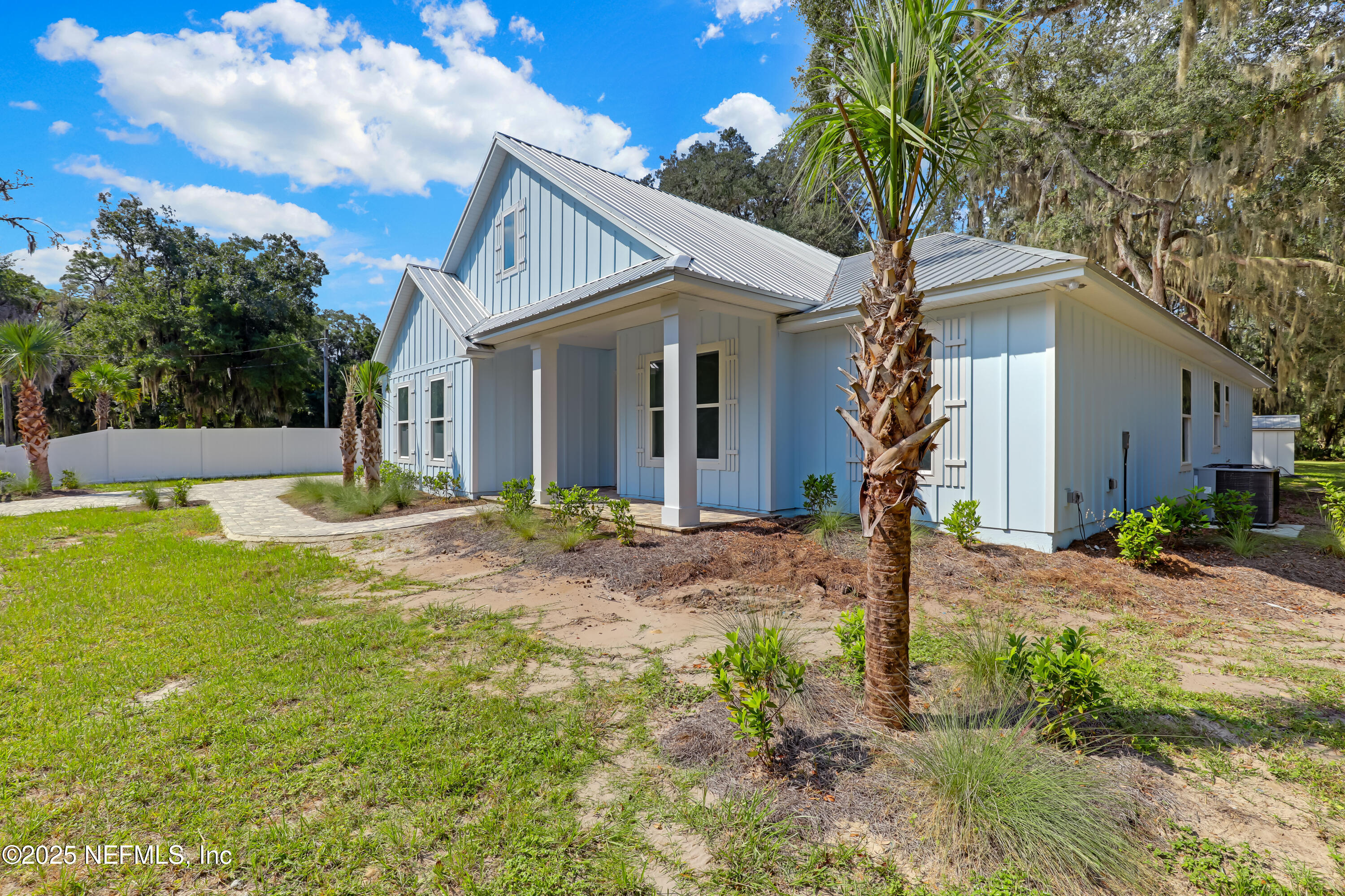 12092 Sheffield Road Jacksonville, FL 32226 - Photo 55 of 55 a front view of house with yard and trees around