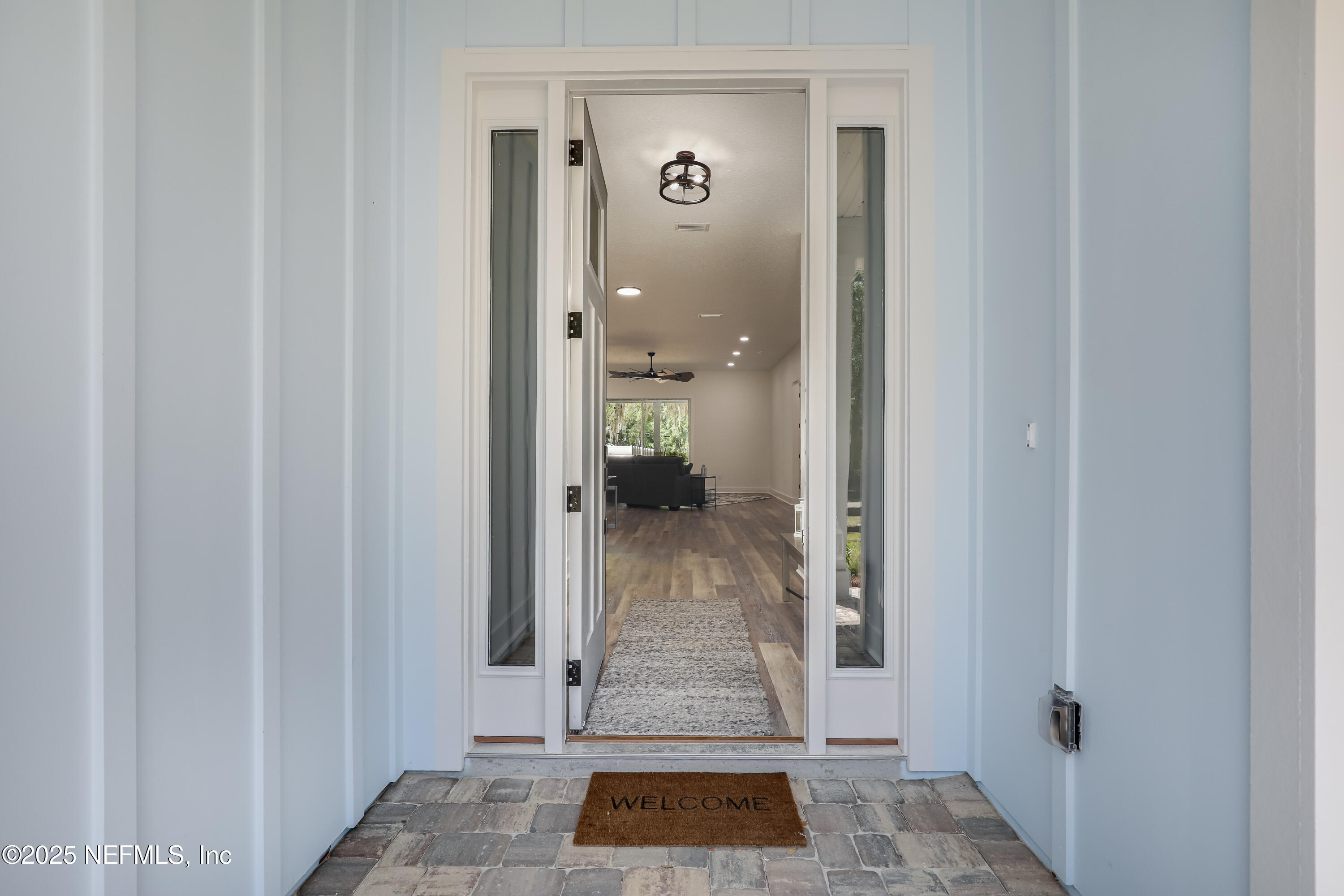 12092 Sheffield Road Jacksonville, FL 32226 - Photo 10 of 55 a view of a hallway with white walls and a door
