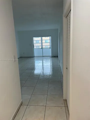 a view of hallway with windows