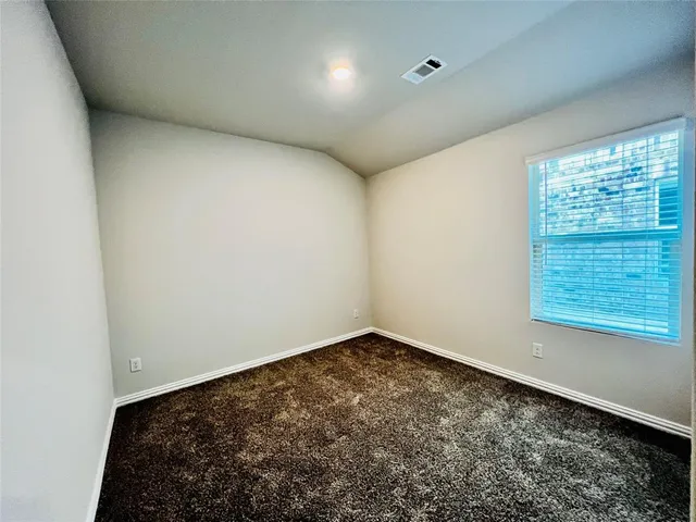 a view of a room with wooden floor and staircase