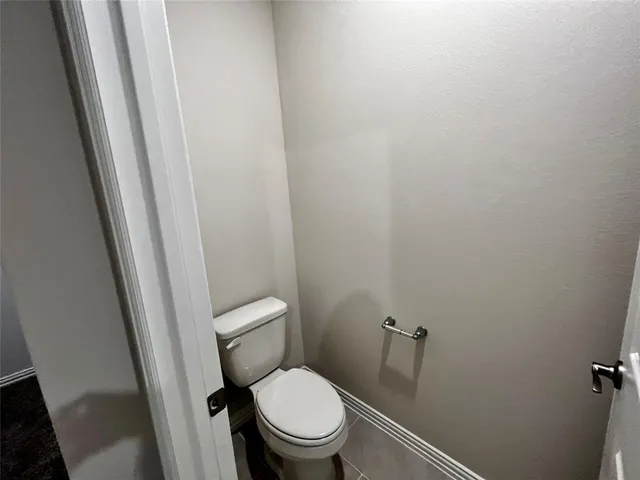 a bathroom with a shower sink vanity and mirror