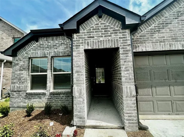 a front view of a house with glass windows