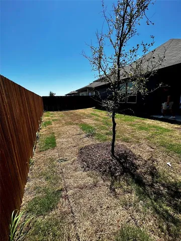 a view of an empty room with a fireplace
