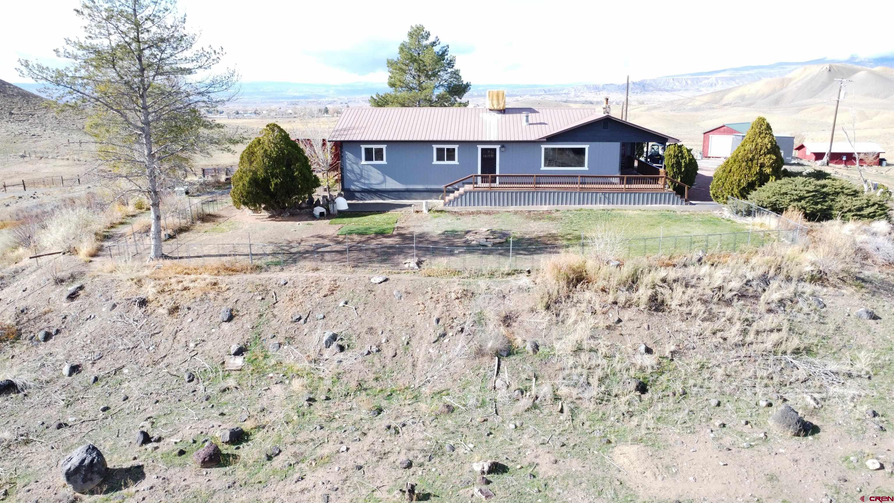 10053 2100th Road Austin, CO 81410 - Photo 3 of 41 an aerial view of a house with a yard