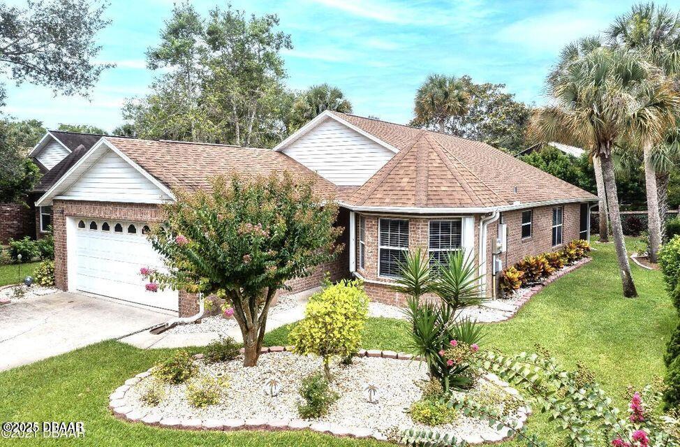 a front view of house with yard and green space