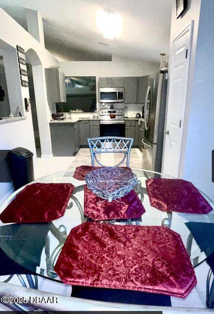 27 Reflections Village Drive Ormond Beach, FL 32174 - Photo 12 of 29 a living room with furniture and a flat screen tv