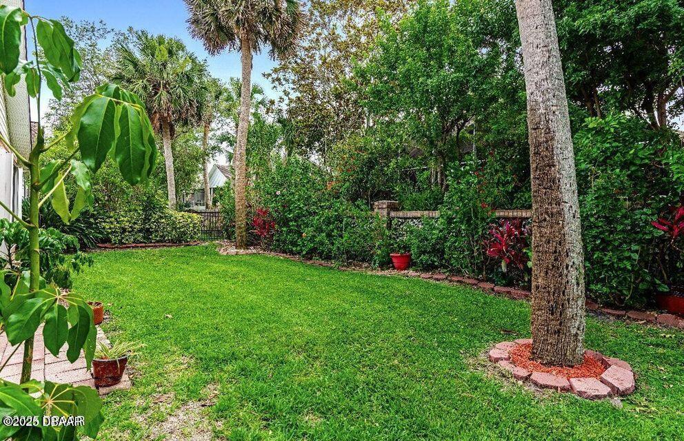 27 Reflections Village Drive Ormond Beach, FL 32174 - Photo 19 of 29 a view of a garden with a tree