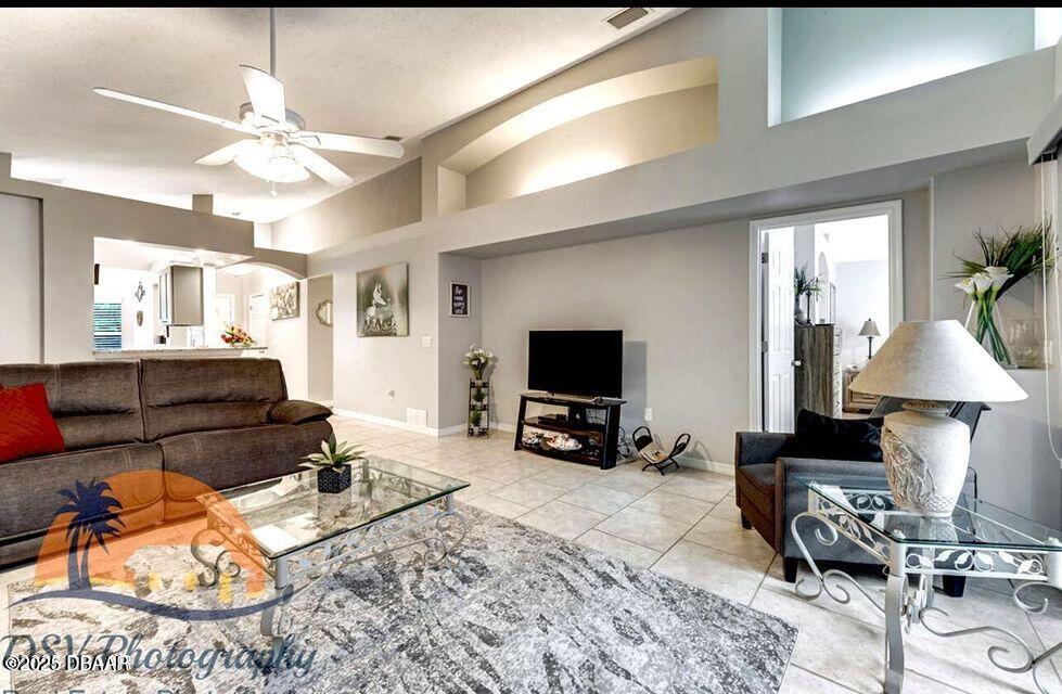 27 Reflections Village Drive Ormond Beach, FL 32174 - Photo 2 of 29 a living room with furniture and a flat screen tv