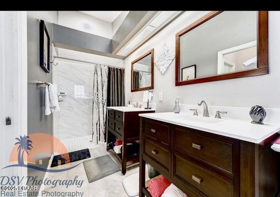 27 Reflections Village Drive Ormond Beach, FL 32174 - Photo 25 of 29 a bathroom with a sink double vanity and a mirror