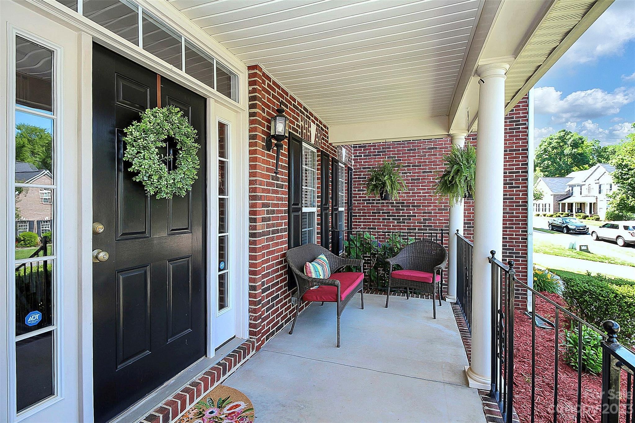 1958 Faison Avenue Fort Mill, SC 29708 - Photo 3 of 37 a view of a porch with chairs and potted plants