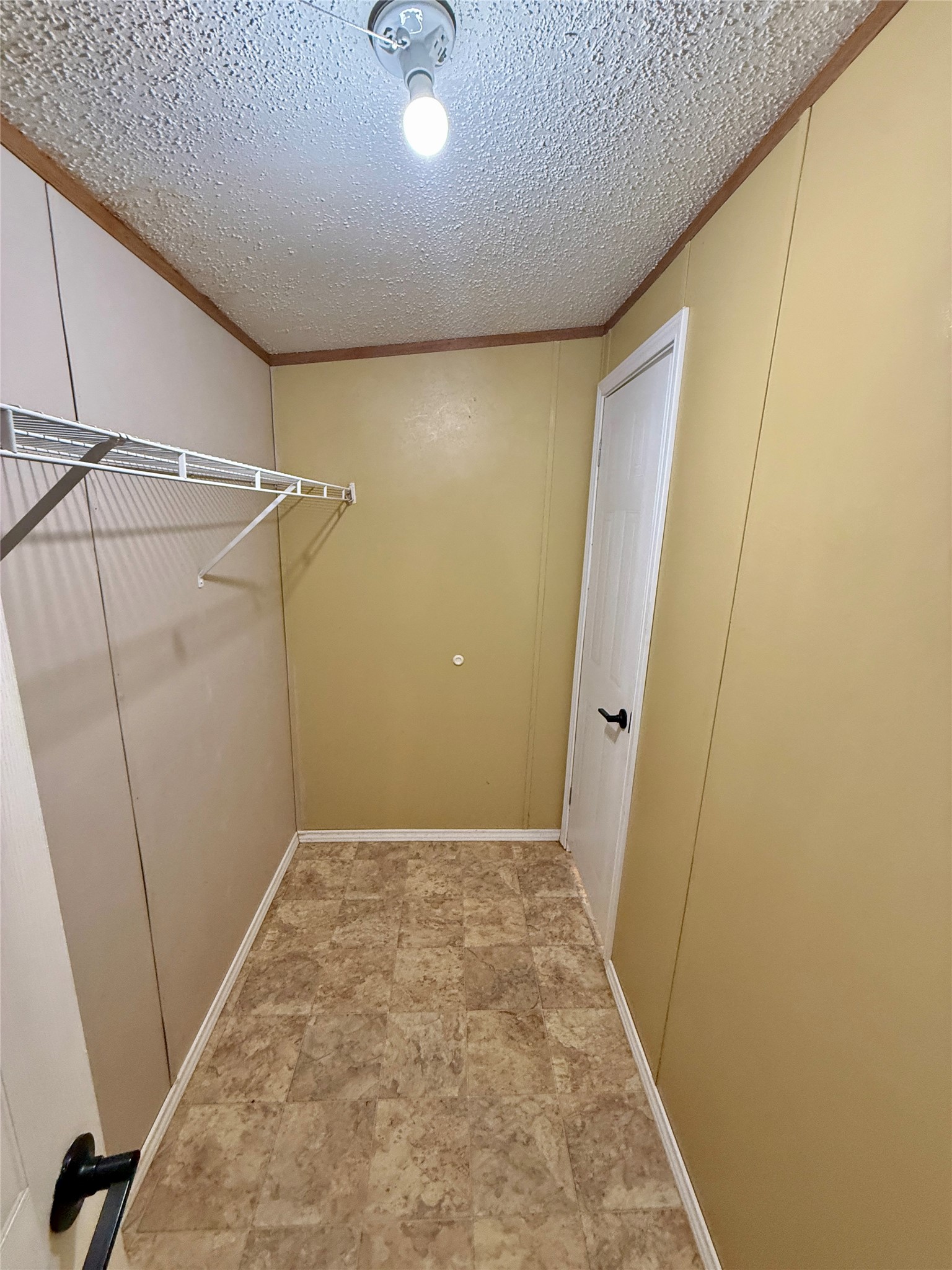 3075 FM 2001 Buda, TX 78610 - Photo 17 of 26 Spacious walk-in closet for the primary bedroom provides convenient organization and storage space.