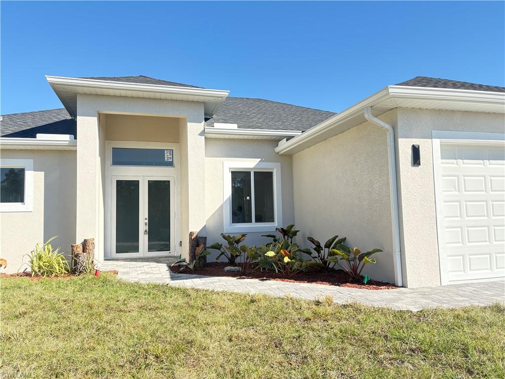 423 Harshaw Street Lehigh Acres, FL 33974 - Photo 2 of 27 a front view of a house