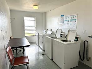 777 South Federal Highway, Unit RPH11 Pompano Beach, FL 33062 - Photo 16 of 32 a room with a chair a table and chairs