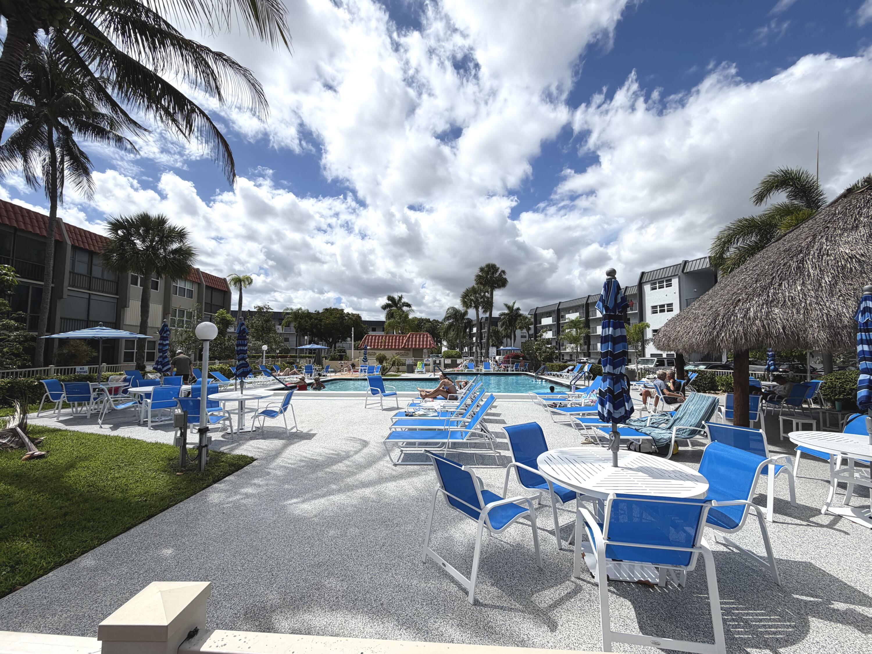 777 South Federal Highway, Unit RPH11 Pompano Beach, FL 33062 - Photo 19 of 32 a view of a patio with a table and chairs and garden