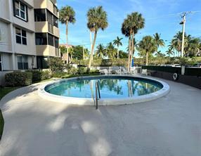 777 South Federal Highway, Unit RPH11 Pompano Beach, FL 33062 - Photo 25 of 32 a large swimming pool with outdoor seating and yard