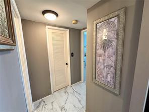 777 South Federal Highway, Unit RPH11 Pompano Beach, FL 33062 - Photo 9 of 32 a view of a hallway with closet and a window