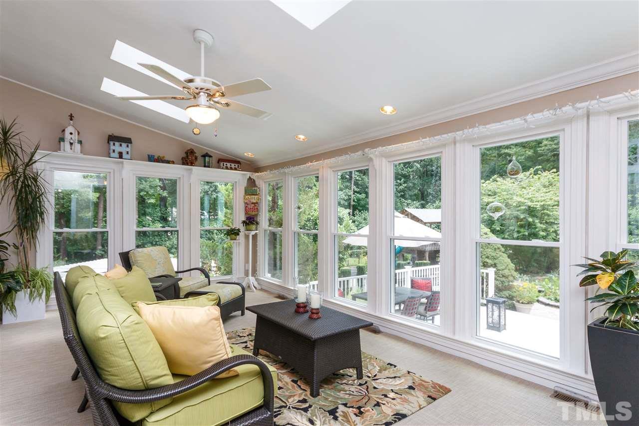 812 Misty Isle Place Raleigh, NC 27615 - Photo 11 of 25 a living room with furniture and large windows