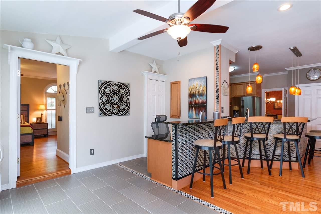 812 Misty Isle Place Raleigh, NC 27615 - Photo 12 of 25 a view of a dining room with furniture and chandelier