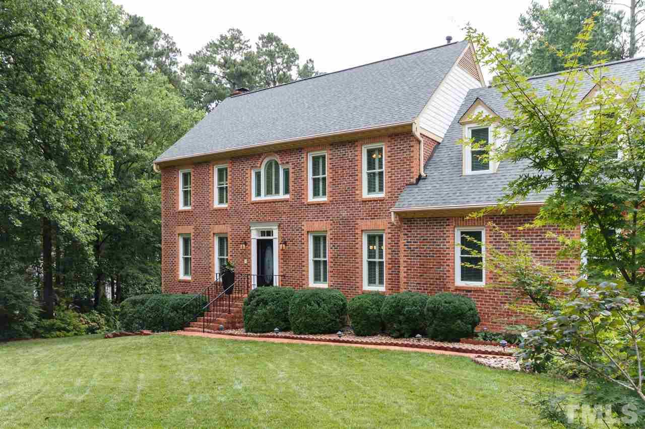 812 Misty Isle Place Raleigh, NC 27615 - Photo 3 of 25 a front view of a house with a yard and garage
