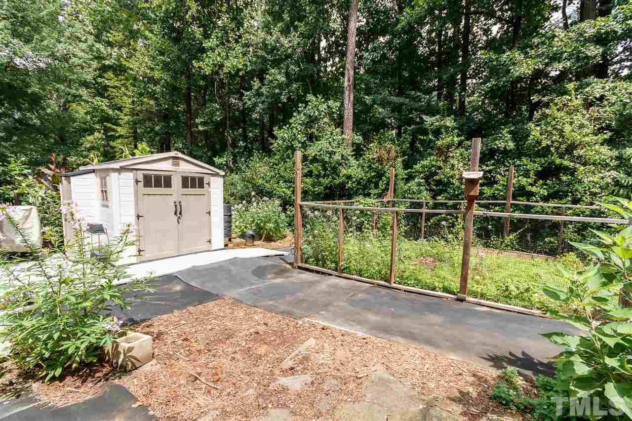 812 Misty Isle Place Raleigh, NC 27615 - Photo 22 of 25 a front view of a house with a yard