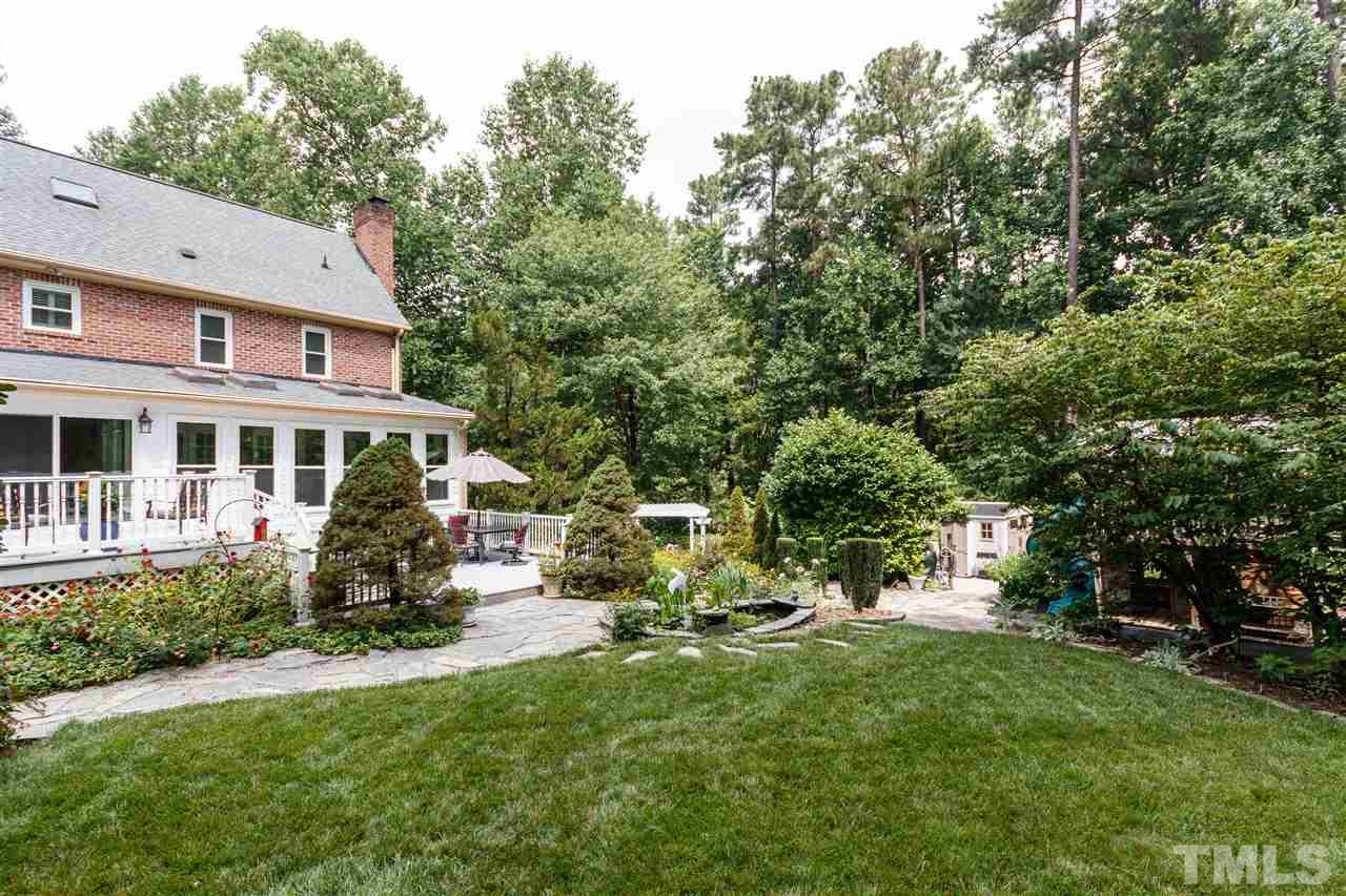 812 Misty Isle Place Raleigh, NC 27615 - Photo 25 of 25 a view of a house with backyard sitting area and garden