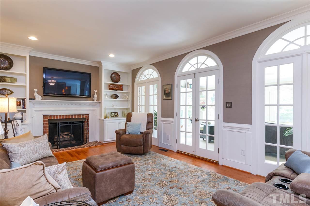 812 Misty Isle Place Raleigh, NC 27615 - Photo 9 of 25 a living room with furniture and a fireplace
