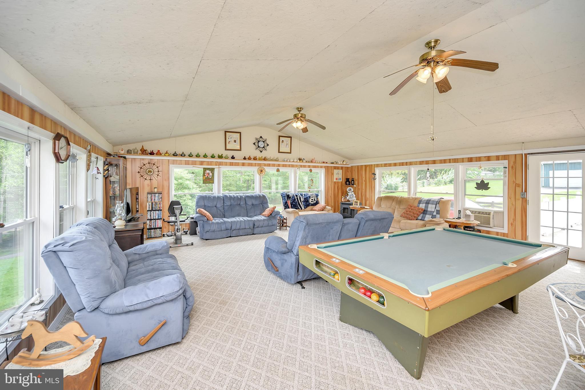 30306 Mine Run Road Locust Grove, VA 22508 - Photo 15 of 52 674 square foot game room with pellet stove