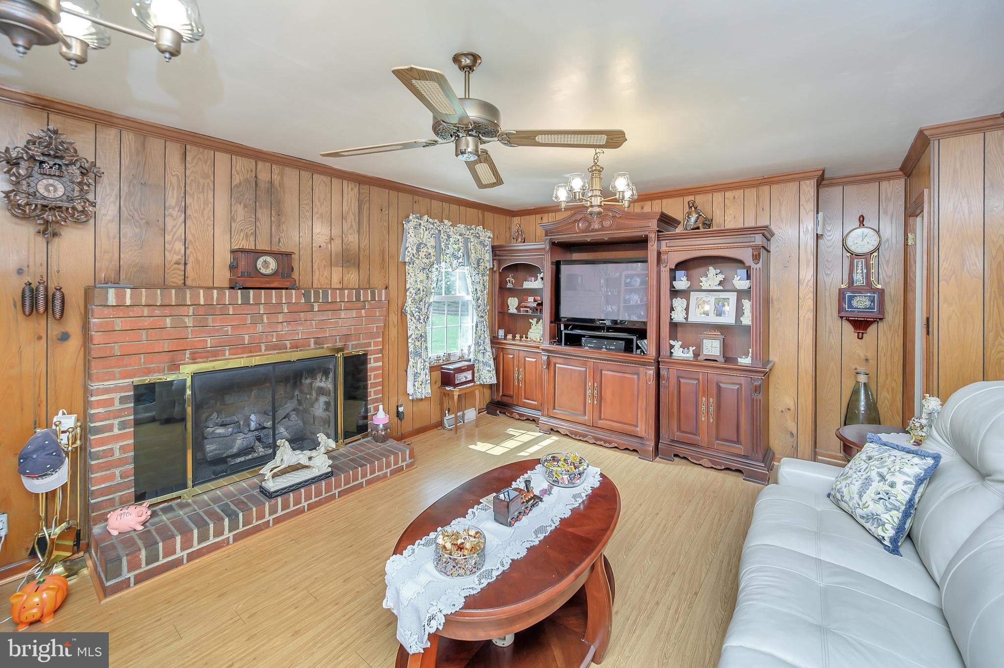 30306 Mine Run Road Locust Grove, VA 22508 - Photo 20 of 52 Family room with brick gas fireplace and mantel