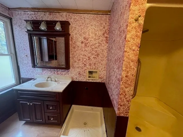 a bathroom with a sink and a mirror