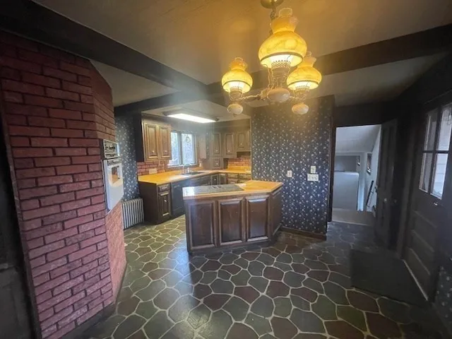 a kitchen with a sink and cabinets