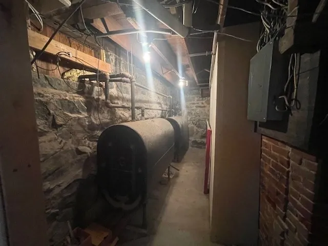 a view of empty room with a fireplace