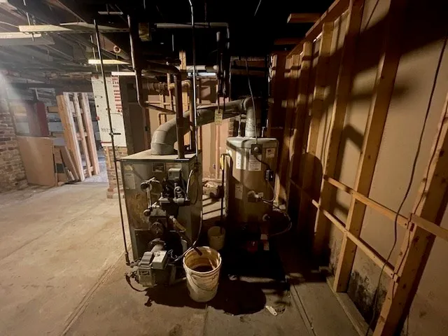 a bathroom with a clock on the wall and cabinets