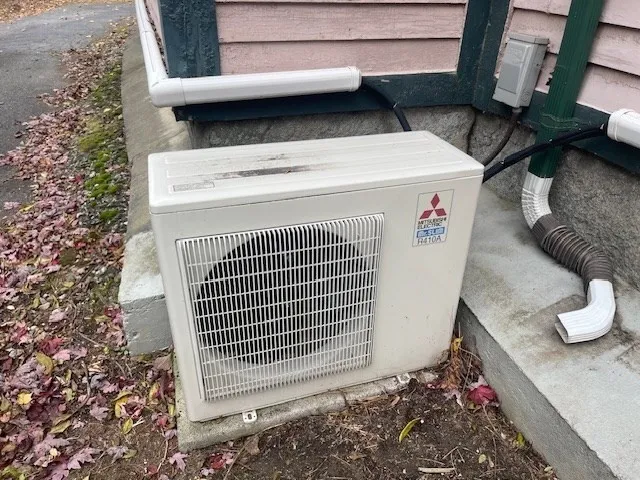 a view of a backyard with a chair