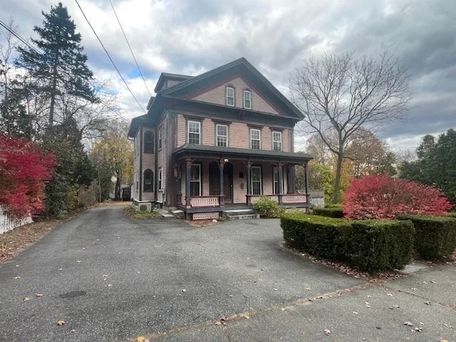 a view of a house with sitting area and garden