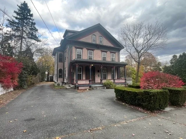 a view of a house with sitting area and garden