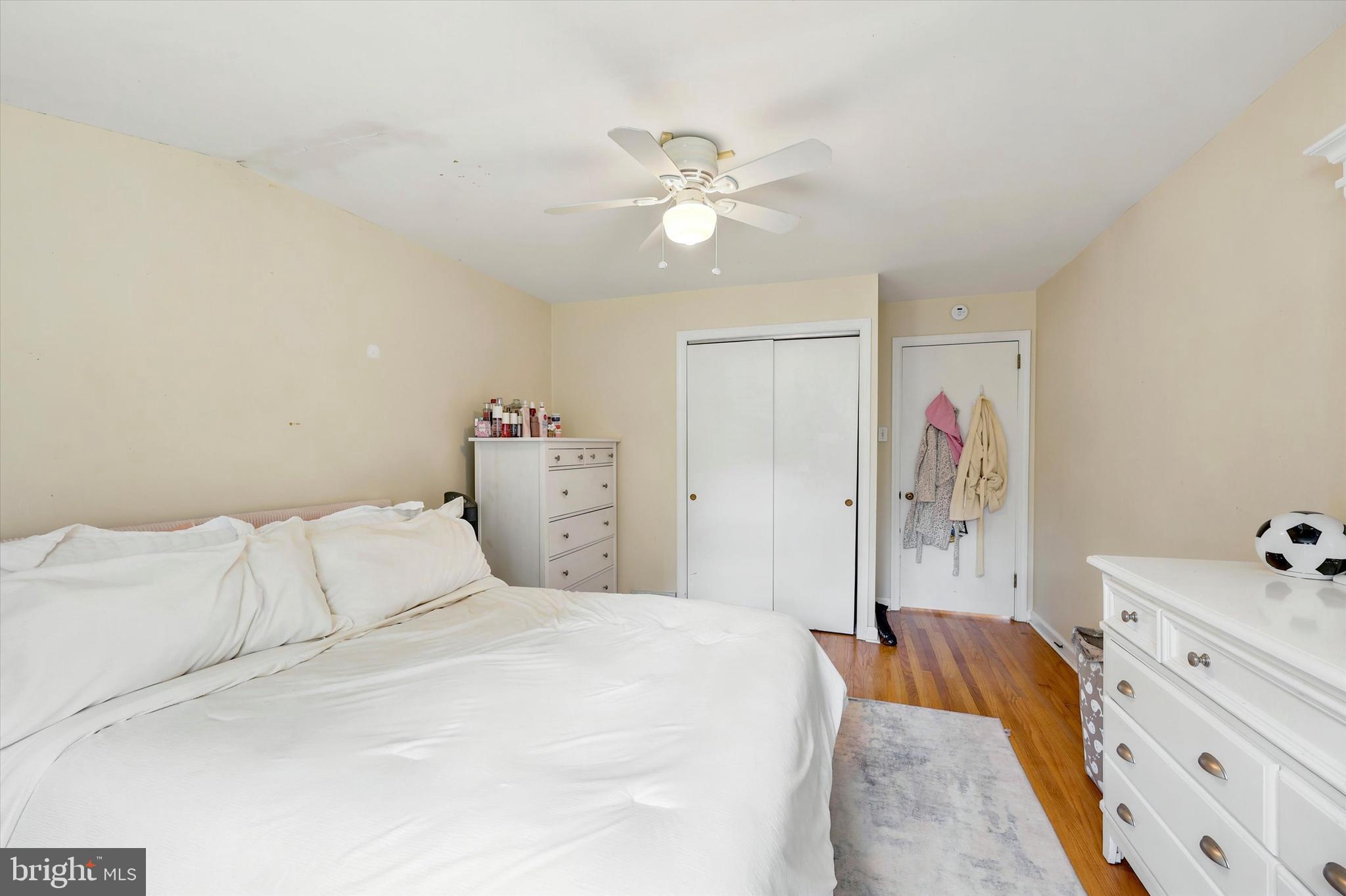 39 Haverford Road Ardmore, PA 19003 - Photo 21 of 24 a bedroom with a bed and a chandelier