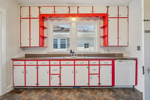 a view of a kitchen with storage and utility