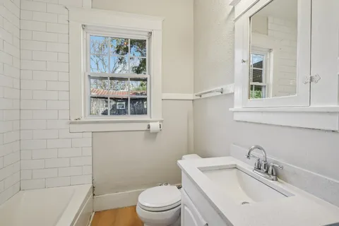 a bathroom with a bathtub and shower