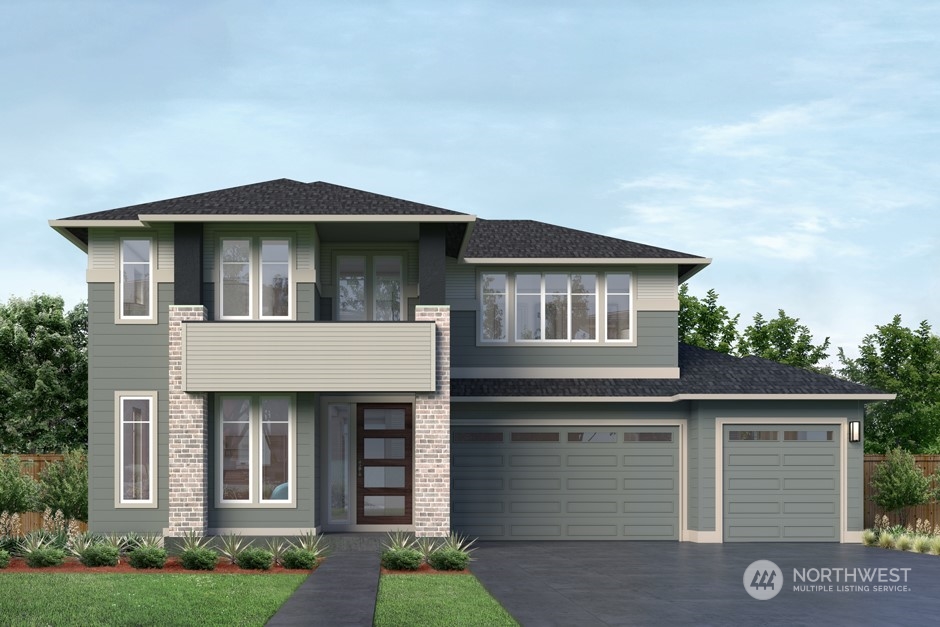 6555 Southeast 8th Street Renton, WA 98059 - Photo 1 of 11 a front view of a house with a yard