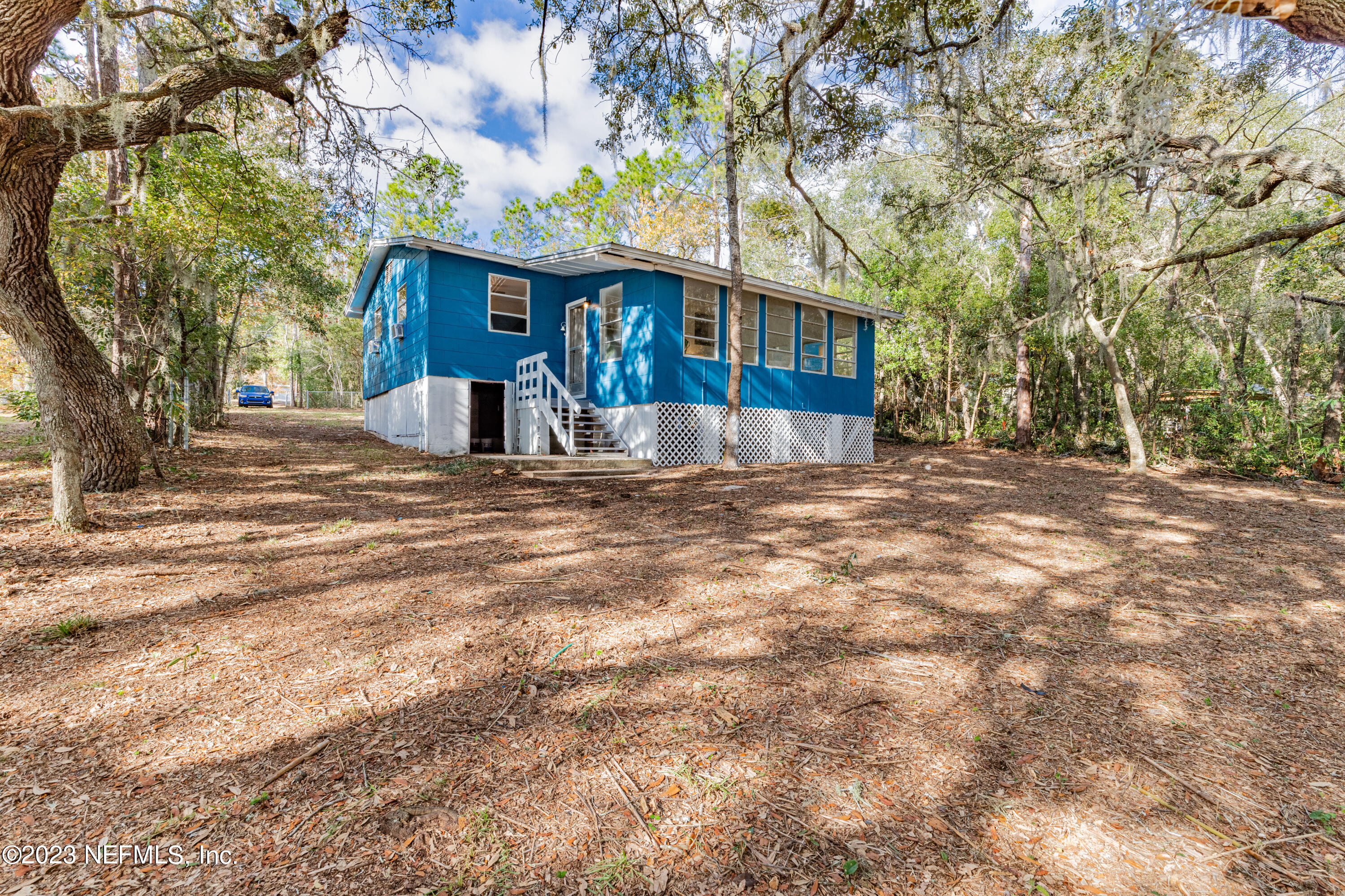 6189 Little Lake Geneva Road Keystone Heights, FL 32656 - Photo 7 of 40 a view of a house with a yard