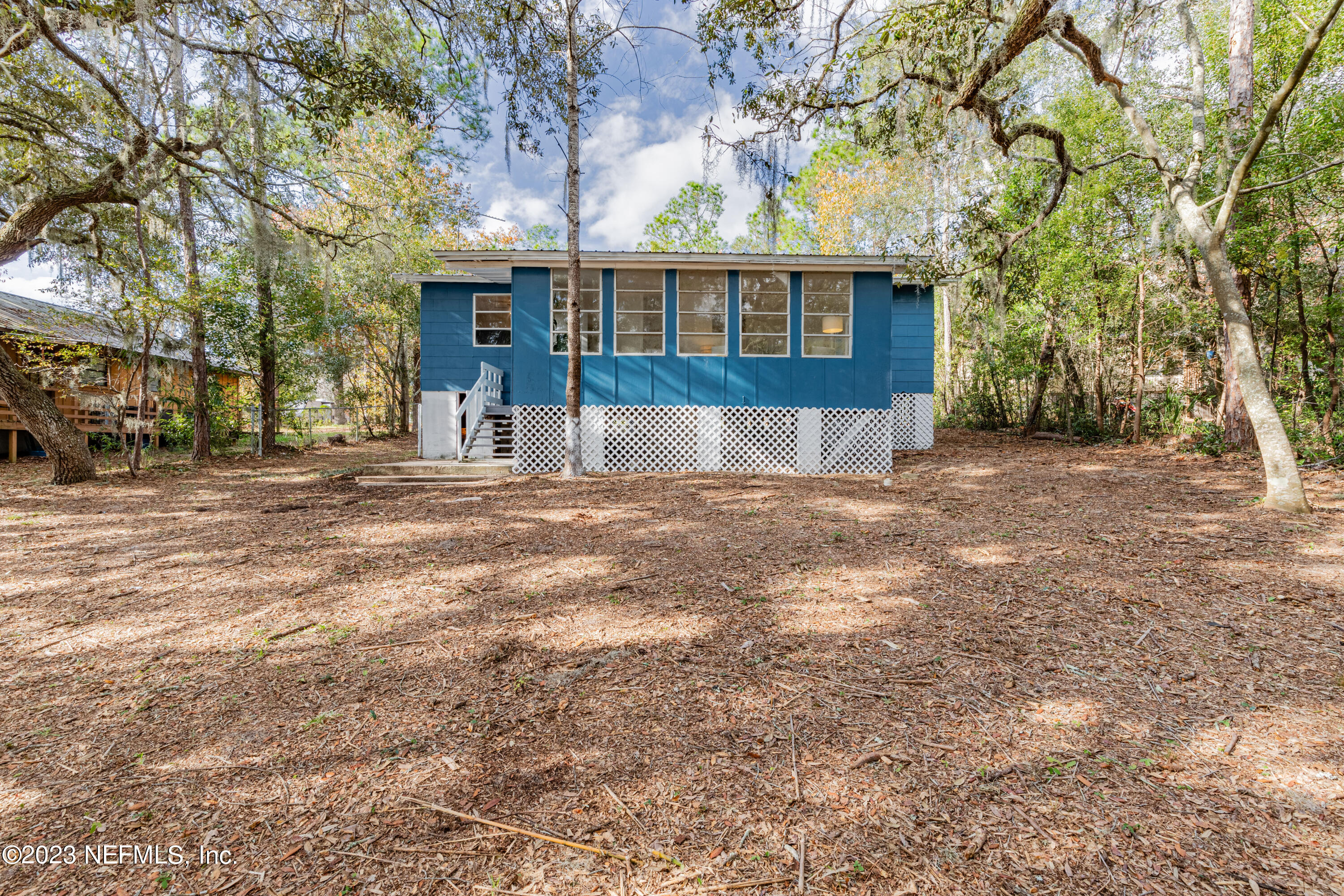 6189 Little Lake Geneva Road Keystone Heights, FL 32656 - Photo 8 of 40 a view of a house with a yard