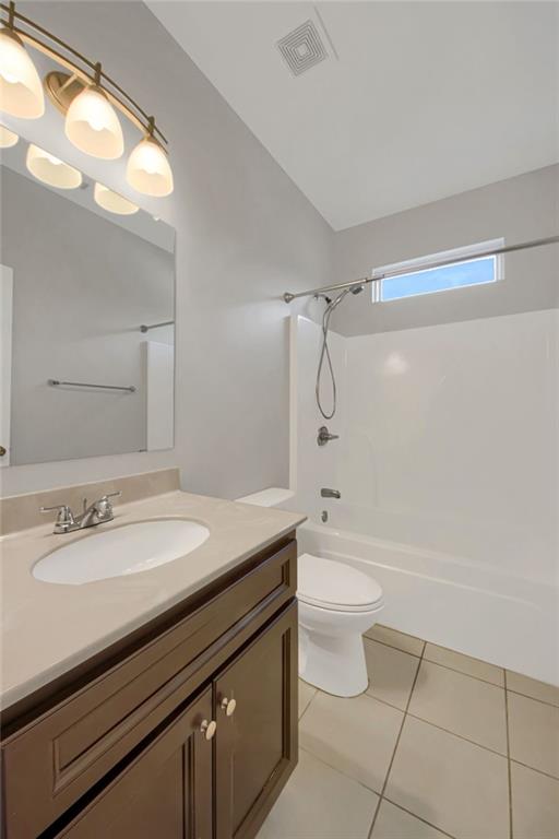 2042 Bolton Road Northwest Atlanta, GA 30318 - Photo 22 of 30 a bathroom with a granite countertop sink a toilet a mirror and shower