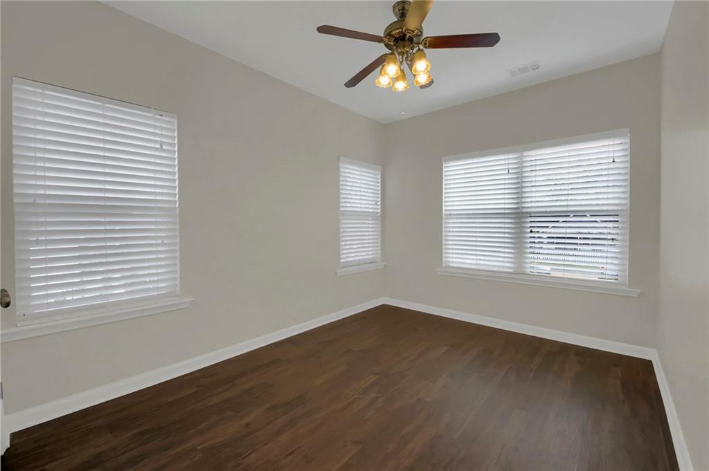 2042 Bolton Road Northwest Atlanta, GA 30318 - Photo 23 of 30 a view of a room with wooden floor and windows
