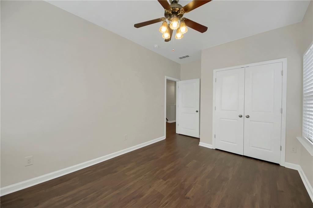 2042 Bolton Road Northwest Atlanta, GA 30318 - Photo 24 of 30 a view of an empty room with wooden floor