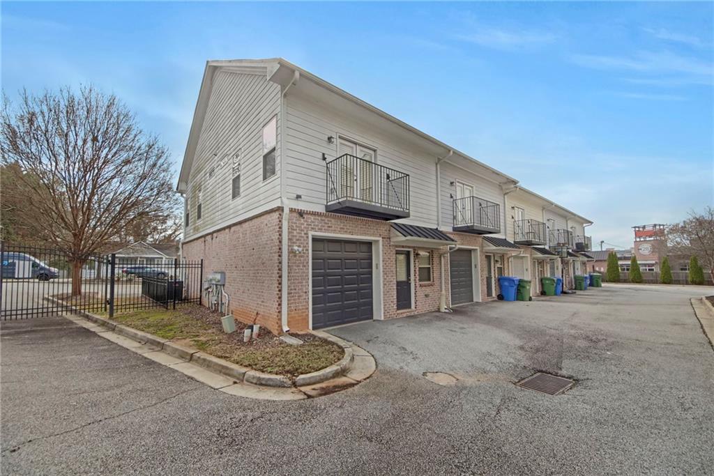 2042 Bolton Road Northwest Atlanta, GA 30318 - Photo 26 of 30 a front view of a house with a yard