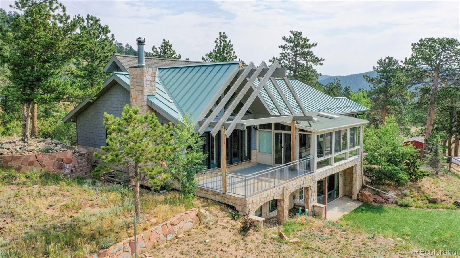 153 Ski Road East Allenspark, CO 80510 - Photo 2 of 40 an aerial view of a house with a yard