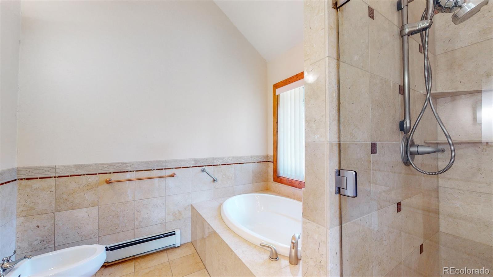 153 Ski Road East Allenspark, CO 80510 - Photo 30 of 40 a bathroom with a shower and a sink