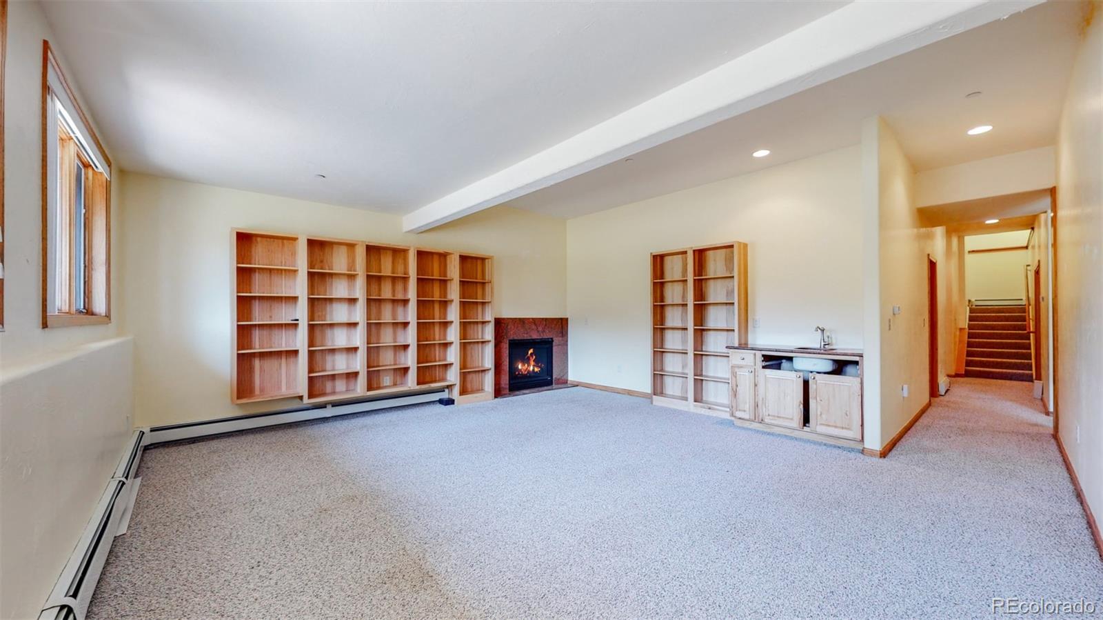 153 Ski Road East Allenspark, CO 80510 - Photo 32 of 40 a view of an empty room with a window and kitchen view